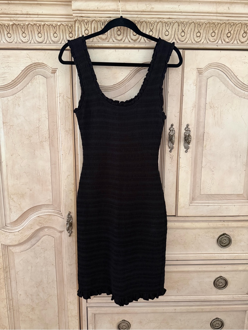 Black Sleeveless Mini Dress with Scoop Neck and Ruffle Trim